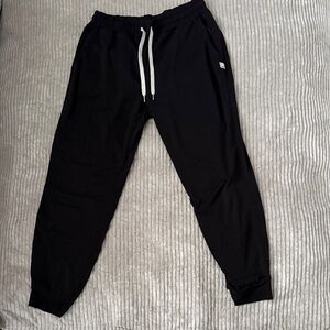 Vuori Black Apparel with White Tag